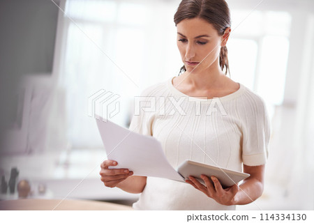Businesswoman reading, paperwork and tablet in office or technology, online documents with serious person. Entrepreneur, creative business planning and internet, social media website and browsing Businesswoman reading, paperwork and tablet in office or technology, online documents with serious person. Entrepreneur, creative business planning and internet, social media website and browsing 114334130