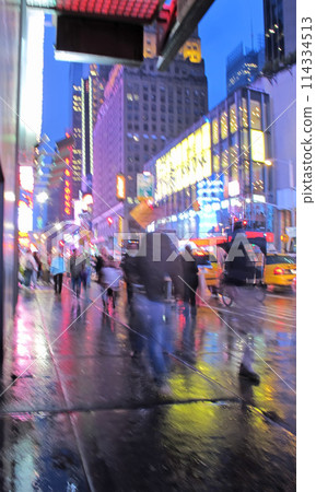 People, walking and street with motion blur at night of busy road with lights in New York City. Group, community or pedestrians on sidewalk in late evening, town square or urban area with traffic 114334513