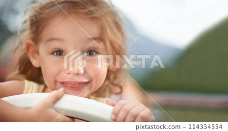 Portrait, smile and child outdoor in summer on holiday, vacation and adorable little girl travel alone in Switzerland for trip. Face, happy and cute kid in nature for journey, adventure and childhood 114334554