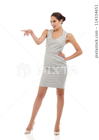Business woman, pointing and promotion with news, announcement and advertisement in studio. Professional, job consultant and corporate fashion with surprise from deal and sale with white background 114334651