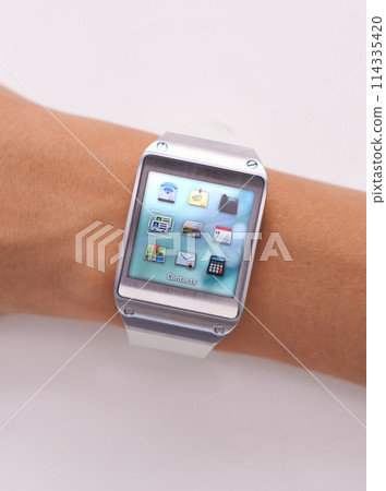 Wrist, smart watch and icons technology or screen for schedule planning on white background, location or studio. Person, arm and display network gadget or futuristic applications, notes or browsing Wrist, smart watch and icons technology or screen for schedule planning on white background, location or studio. Person, arm and display network gadget or futuristic applications, notes or browsing 114335420