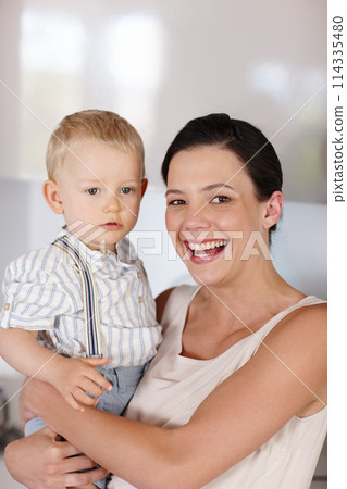 Woman, child and portrait in house with smile, development and happiness for love, youth and care indoor. Mother, young boy or holding kid and happy for bonding together, family and cute on weekend 114335480