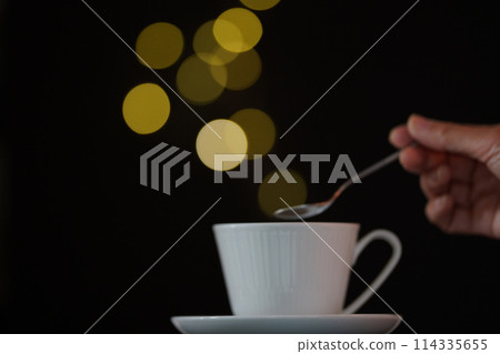 A soothing drink overflowing with steaming light 114335655