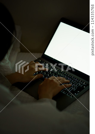 Young woman spending her time in bed Young woman spending her time in bed 114335768