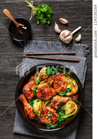 roasted asian glazed chicken thighs with bok choy 114336164