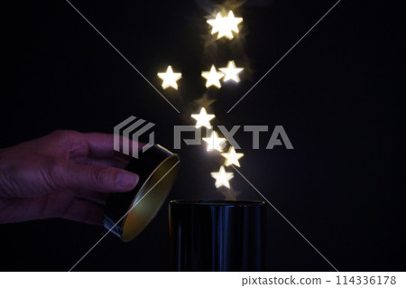 A can overflowing with starlight 114336178