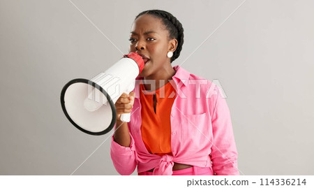 Megaphone, angry and black woman on gray background for protest, revolution and rights for equality. Communication, bullhorn and person shouting for information, announcement and speech in studio Megaphone, angry and black woman on gray background for protest, revolution and rights for equality. Communication, bullhorn and person shouting for information, announcement and speech in studio 114336214