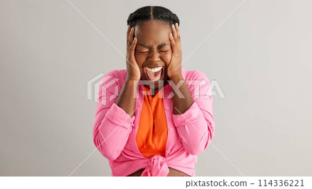 Anxiety, screaming and hands on face of black woman in studio with mental health crisis on grey background. Stress, shout and female model overthinking mistake, fail or frustrated, fear or disaster Anxiety, screaming and hands on face of black woman in studio with mental health crisis on grey background. Stress, shout and female model overthinking mistake, fail or frustrated, fear or disaster 114336221