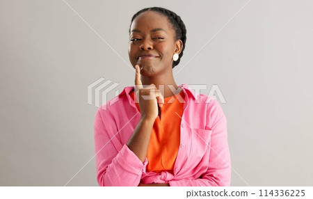 Thinking, smile and black woman in studio with idea, solution or insight expression on grey background. Why, face and female model with brainstorming emoji for choice, opinion or solution decision Thinking, smile and black woman in studio with idea, solution or insight expression on grey background. Why, face and female model with brainstorming emoji for choice, opinion or solution decision 114336225
