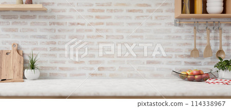 A space on a white kitchen tabletop with minimalist utensil and decor against the brick wall. 114338967