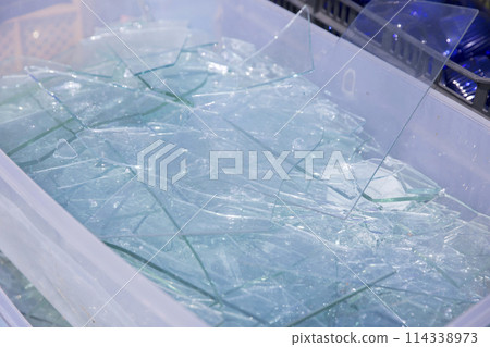 Lots of broken glass fragments, waste material image 114338973