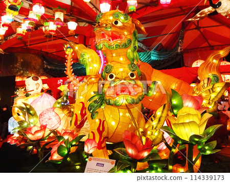 Golden lantern shining at night 114339173