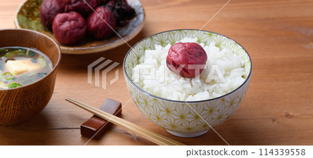 Traditional sour pickled plum served on rice Traditional sour pickled plum served on rice 114339558