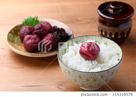 Traditional sour pickled plum served on rice Traditional sour pickled plum served on rice 114339576
