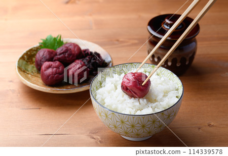 Traditional sour pickled plum served on rice 114339578