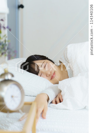 A young woman waking up refreshed in the morning A young woman waking up refreshed in the morning 114340106
