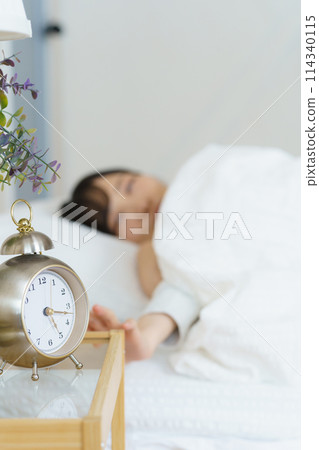 A young woman waking up refreshed in the morning A young woman waking up refreshed in the morning 114340115