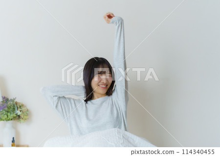 A young woman waking up refreshed in the morning A young woman waking up refreshed in the morning 114340455