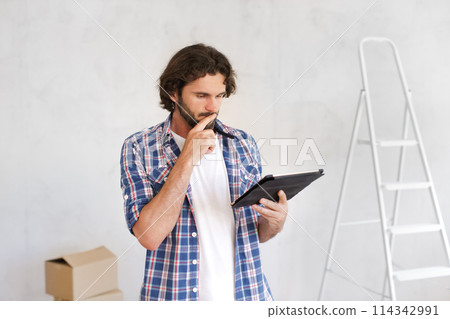 Thinking Painter Man Portrait With Tablet PC Before Renovation Thinking Painter Man Portrait With Tablet PC Before Renovation 114342991
