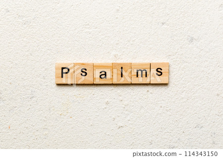 psalms word written on wood block. psalms text on table, concept 114343150