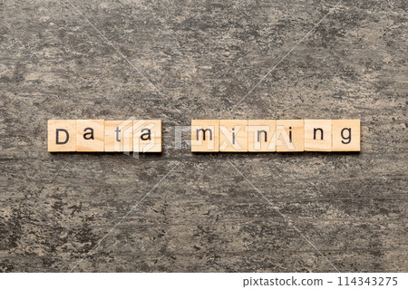 Data mining word written on wood block. Data mining text on cement table for your desing, concept Data mining word written on wood block. Data mining text on cement table for your desing, concept 114343275