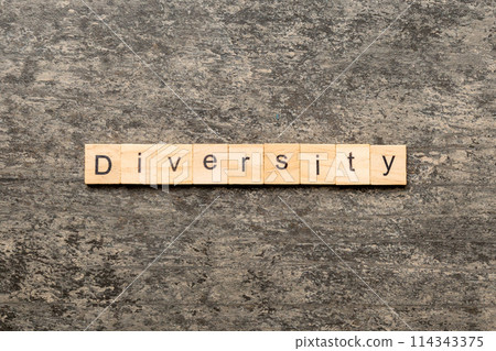 Diversity word written on wood block. Diversity text on cement table for your desing, concept Diversity word written on wood block. Diversity text on cement table for your desing, concept 114343375