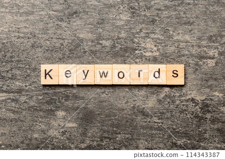 KEYWORDS word written on wood block. KEYWORDS text on cement table for your desing, concept KEYWORDS word written on wood block. KEYWORDS text on cement table for your desing, concept 114343387