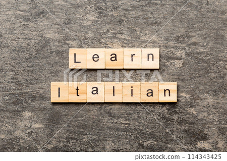 learn italian word written on wood block. learn italian text on table, concept 114343425
