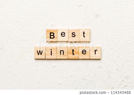 best winter word written on wood block. best winter text on cement table for your desing, concept 114343488