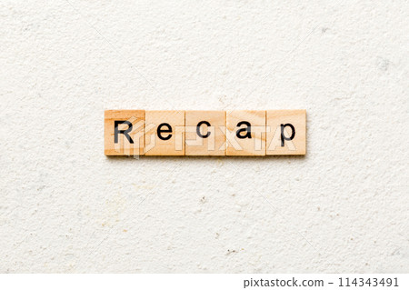 recap word written on wood block. recap text on table, concept 114343491