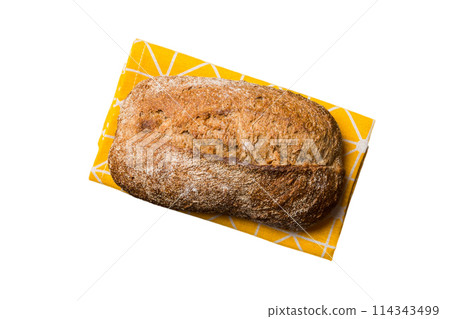 Freshly baked delicious french bread with napkin isolated on white background top view. Healthy white bread loaf 114343499