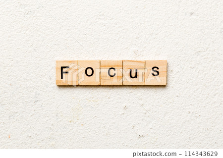 focus word written on wood block. focus text on table, concept focus word written on wood block. focus text on table, concept 114343629