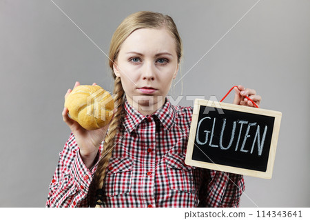 Woman holding board with gluten and bread Woman holding board with gluten and bread 114343641