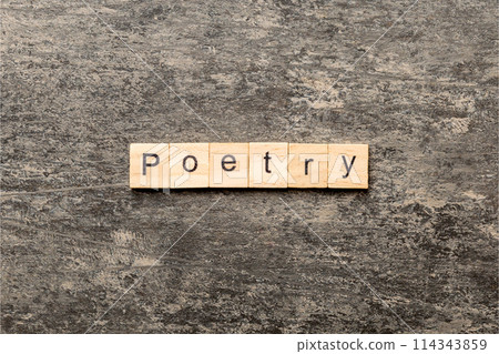 Poetry word written on wood block. Poetry text on cement table for your desing, Top view concept Poetry word written on wood block. Poetry text on cement table for your desing, Top view concept 114343859