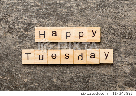Happy Tuesday word written on wood block. Happy Tuesday text on cement table for your desing, concept Happy Tuesday word written on wood block. Happy Tuesday text on cement table for your desing, concept 114343885