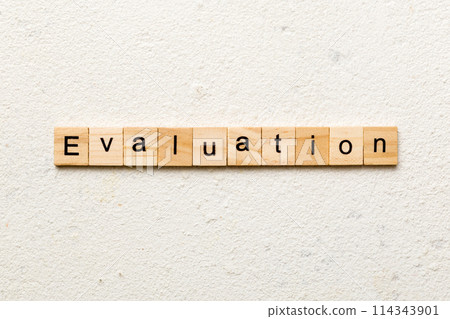 evaluation word written on wood block. evaluation text on table, concept evaluation word written on wood block. evaluation text on table, concept 114343901