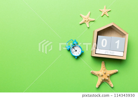 June 1th. Image of june 1 wooden calendar on colored background. Summer day. Empty space for text June 1th. Image of june 1 wooden calendar on colored background. Summer day. Empty space for text 114343930