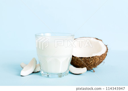 coconut products on white wooden table background. Dairy free milk substitute drink, Flat lay healthy eating 114343947