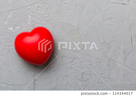 red heart shape on colored background. minimal concept top view with copy space 114344017
