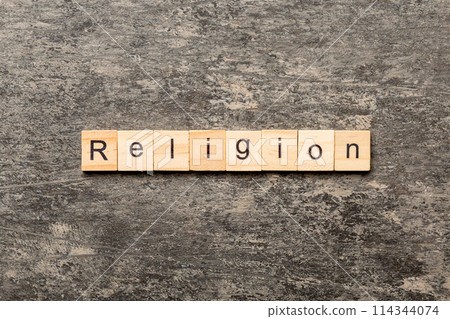 Religion word written on wood block. Religion text on cement table for your desing, concept 114344074