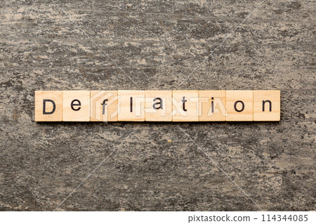 deflation word written on wood block. deflation text on table, concept deflation word written on wood block. deflation text on table, concept 114344085