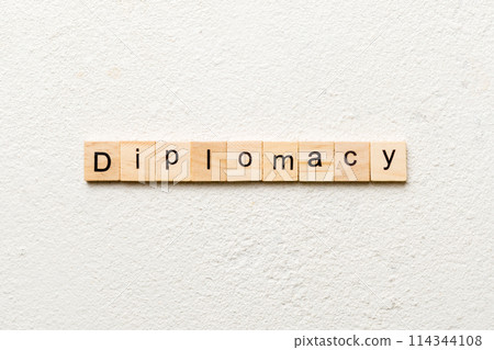 diplomacy word written on wood block. diplomacy text on cement table for your desing, concept 114344108