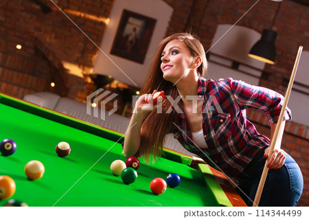 Young woman having fun with billiard. Young woman having fun with billiard. 114344499