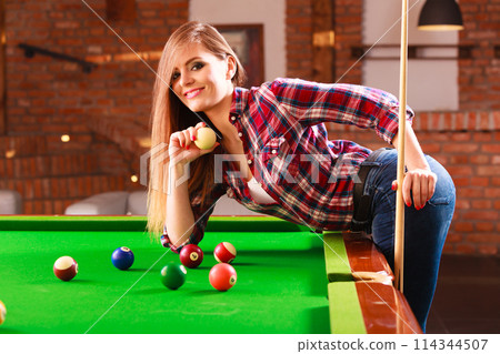 Young woman having fun with billiard. Young woman having fun with billiard. 114344507