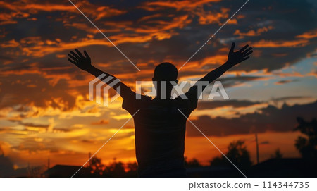 Silhouette of man raising hands in sunset, embodying worship, prayer, and praise Silhouette of man raising hands in sunset, embodying worship, prayer, and praise 114344735