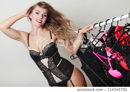 Expressive sexy lady with collection of lingerie. 114344789