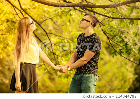 Affectionate couple in park. 114344792