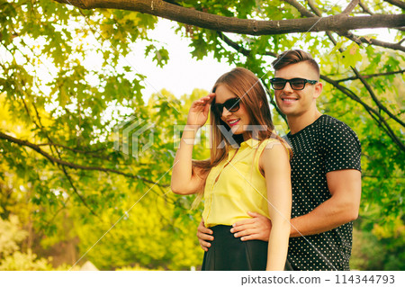 Smiling couple in park Smiling couple in park 114344793