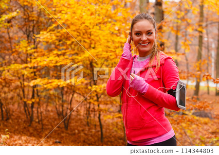 Sporty girl rest in forest listening music. Sporty girl rest in forest listening music. 114344803