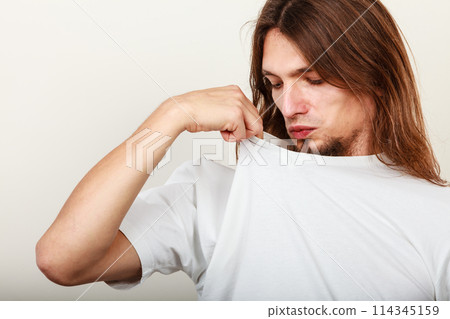 Man with odor of sweat Man with odor of sweat 114345159